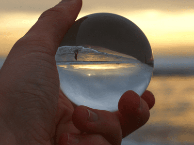 upside down globe in hand