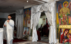 Calum Samuelson giving a presentation in an Ethiopian church setting
