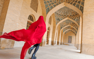 Girl running through streets of Yazd