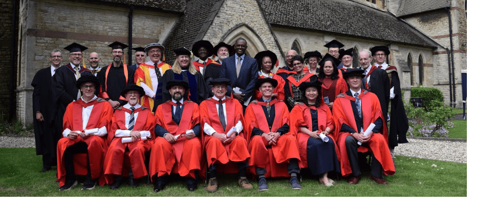 Line up of OCMS graduates, faculty, supervisors and Middlesex University representatives.